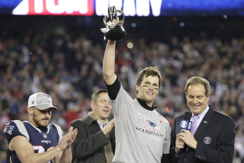 New England Patriots quarterback Tom Brady holds the Lamar Hunt Trophy after leading his team to a comeback win over the Jacksonville Jaguars 24-20 in the AFC Championship game at Gillette Stadium in Foxborough, Massachusetts on January 21, 2018. Photo by John Angelillo/ UPI