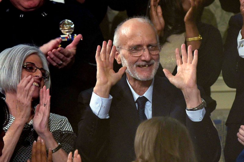 Alan Gross (C), the US contractor released from prison in Cuba last month, is applauded during US President Barack Obama's State of the Union address at the US Capitol in Washington on January 20, 2015. Pool Photo by Mandel Ngan/UPI | <a href="/News_Photos/lp/3df9b3f877703d118d057d192ac64d10/" target="_blank">License Photo</a>