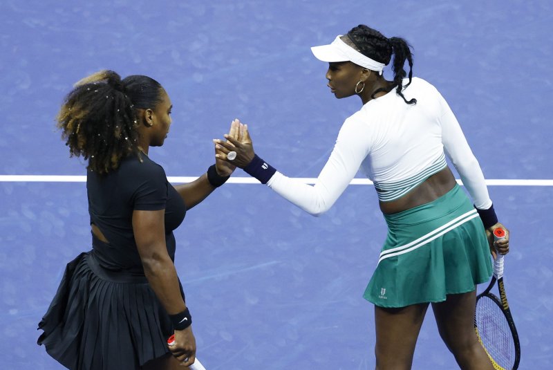 Venus and Serena Williams were eliminated in the first round after playing their first tournament match together in 25 years at the U.S. Open on Thursday night. Photo by John Angelillo/UPI