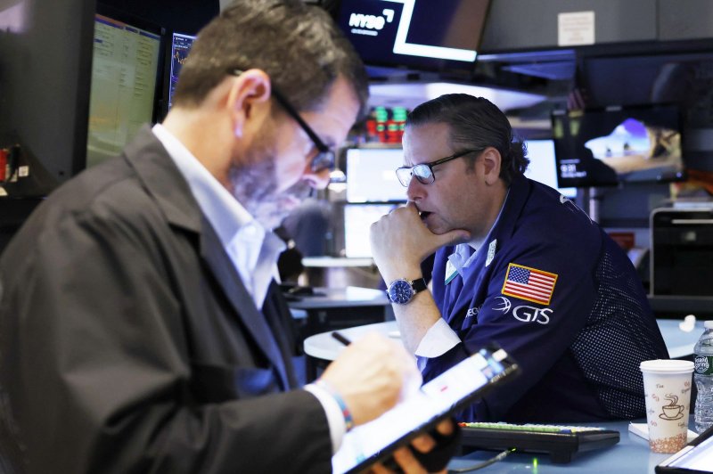 Traders work on the floor of the NYSE at the opening bell at the New York Stock Exchange on Wall Street in New York City on May 9. The Dow Jones Industrial Average gained 550 points on Monday as markets rallied. File Photo by John Angelillo/UPI