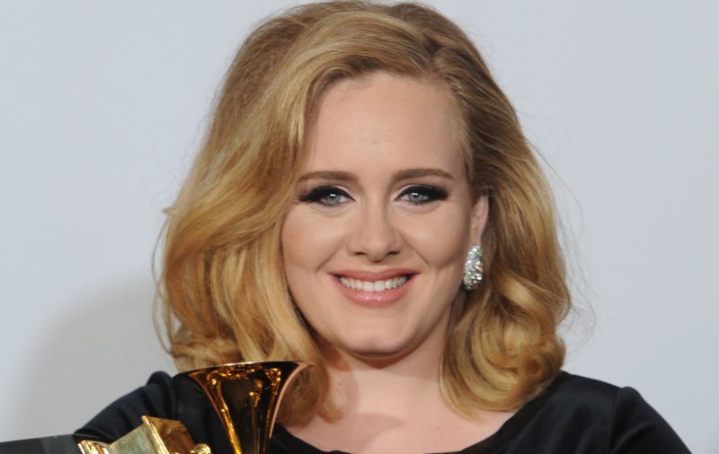 Adele cradles the six awards she won at the 54th annual Grammy Awards at the Staples Center in Los Angeles on February 12, 2012. UPI/Jayne Kamin-Oncea