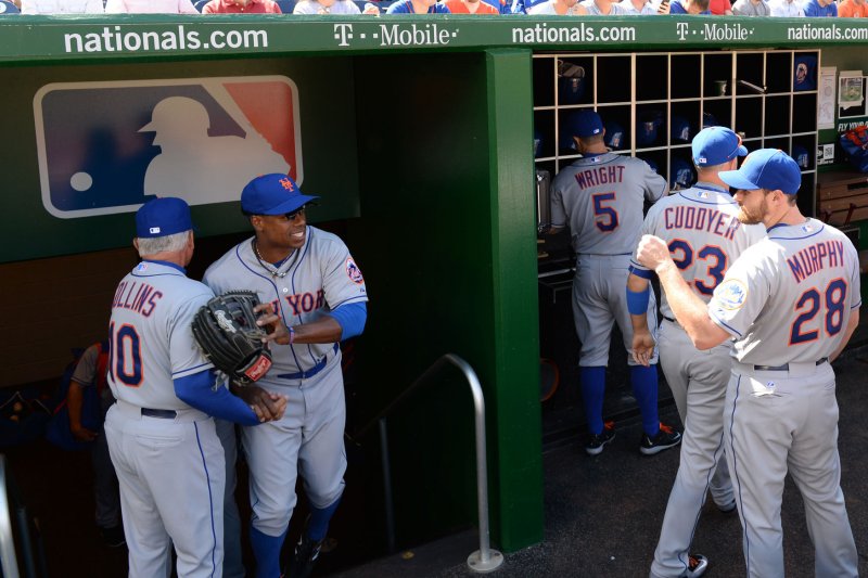 New York Mets Manager Terry Collins greets Curtis Granderson and the rest of the team as they arrive on the field for the game against the Washington Nationals on Opening Day at Nationals Park on April 6, 2015 in Washington, DC. Mets won 3-1 Photo by Pat Benic/UPI