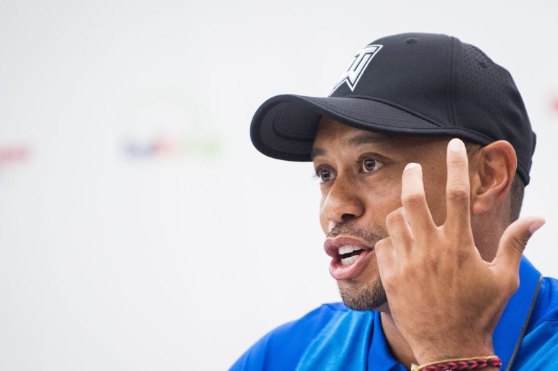 Professional golfer and tournament host, Tiger Woods, answers questions about his event and his health from the media during a press conference at the 2016 Quicken Loans National golf tournament in Bethesda, Md. File photo by Pete Marovich/UPI