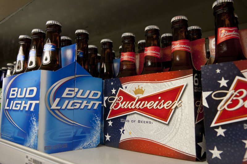 Citizens in a town in Illinois helped themselves to bottles of Bud Light after several cases of beer fell off the back of a delivery truck. Photo by Gary C. Caskey/UPI