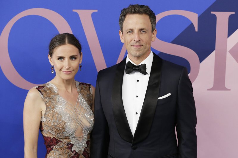 Seth Meyers (R), pictured with Alexi Ashe, said his wife gave birth to a baby boy in the lobby of their apartment building. File Photo by John Angelillo/UPI