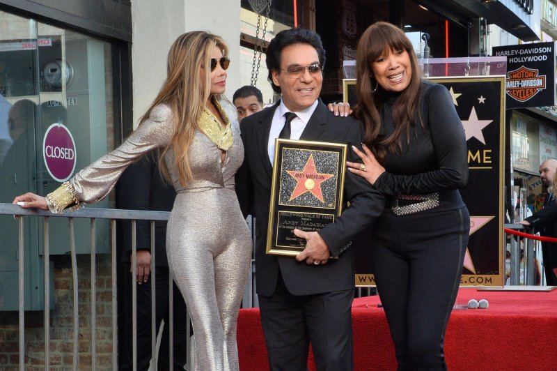 Andy Madadian (C) holds a replica plaque as singers La Toya Jackson (L) and Anita Pointer (R) join him during an unveiling ceremony honoring Madadian with the 2,684th star on the Hollywood Walk of Fame in 2020. Pointer died Saturday at the age of 74. File Photo by Jim Ruymen/UPI