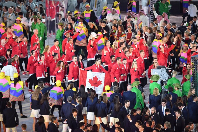 Rosannagh MacLennan holds the flag of Canada as she leads the athletes into the arena at the Opening Ceremony of the 2016 Rio Summer Olympics begins in Rio de Janeiro, Brazil on August 5, 2016. On Wednesday, the Canadian Senate passed a bill that will make gender-neutral changes to lyrics in the country's national anthem. File Photo by Kevin Dietsch/UPI
