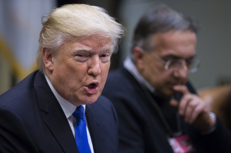President Donald Trump, pictured with CEO of Fiat Chrysler Automobiles Sergio Marchionne, delivers remarks to automobile industry leaders during a meeting in the Roosevelt Room of the White House in Washington, D.C., January 24, 2017. Pool Photo by Shawn Thew/UPI