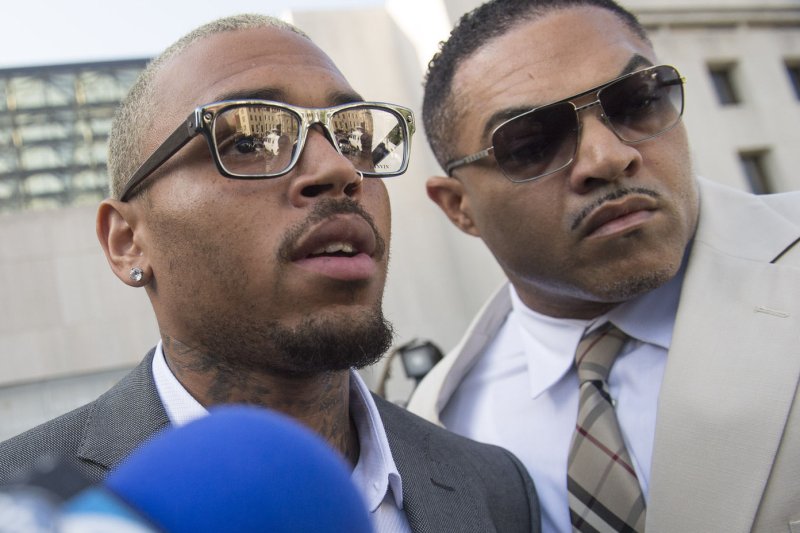 Entertainer Chris Brown leaves the H. Carl Moultrie Courthouse in Washington, D.C. after pleading guilty to assault, September 2, 2014. Brown pleaded guilty to assaulting a man outside a Washington hotel last October and was sentenced to time served. Brown served two days in jail when originally arrested on the charges. UPI/Kevin Dietsch | <a href="/News_Photos/lp/abc9113864f3f19cee1c094e7cecd1aa/" target="_blank">License Photo</a>