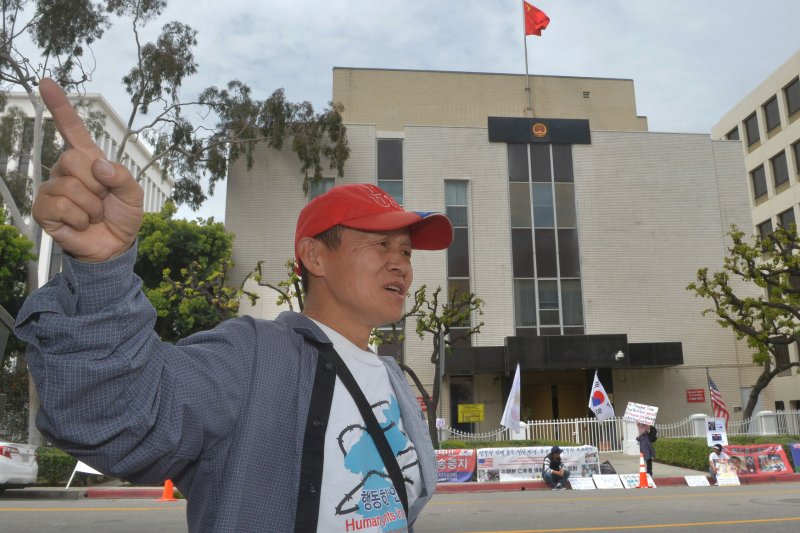Cho Bo-eol, 50, demonstrating outside the Chinese consulate in Los Angeles on March 20. Cho and other activists say North Korean refugees' organs are being harvested in China. Photo by Jim Ruymen/UPI