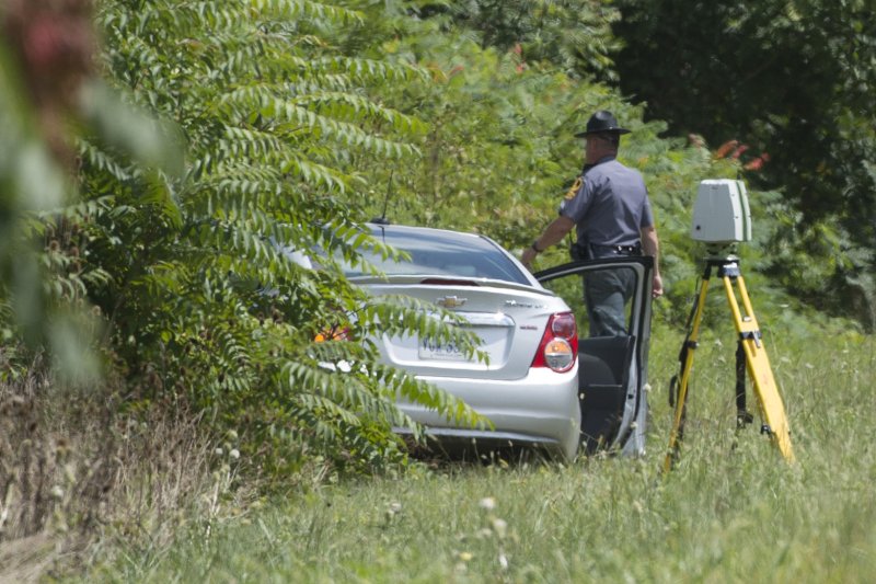 Police and law enforcement respond to the location where WDBJ-TV shooting suspect Vester Lee Flanagan II shot and killed himself Wednesday on Route 66 near Markham, Va. Flanagan is the suspected gunman in the shooting deaths of reporter Alison Parker and camera operator Adam Ward during a live broadcast. Photo by Kevin Dietsch/UPI
