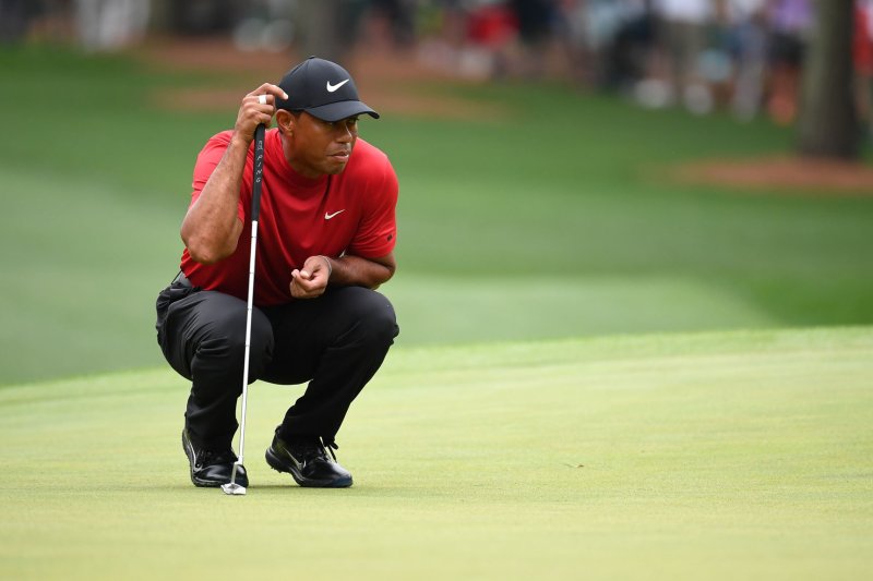 Tiger Woods, shown April 14, 2019, at the Masters Tournament, is known for wearing red and black during the final round of tournaments. File Photo by Kevin Dietsch/UPI