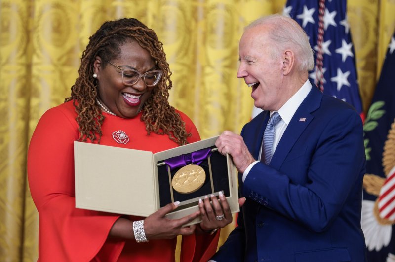 Sabine LaFortune from The Billie Holiday Theatre appears on stage with President Joe Biden during an event for the Arts and Humanities Award Ceremony in The East Room of The White House in Washington on Tuesday. Photo by Oliver Contreras/UPI