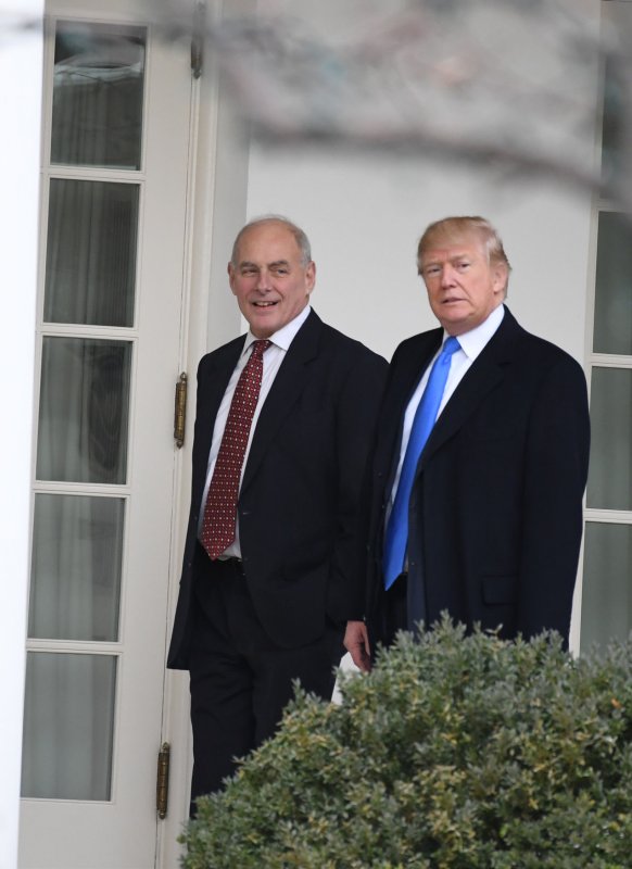 President Donald Trump walks back to the Oval Office with chief of Staff John Kelly on December 20. On Wednesday, Kelly said Trump's border wall promise was 'not informed" and said the president has 'evolved' on some immigration issues. Photo by Pat Benic/UPI