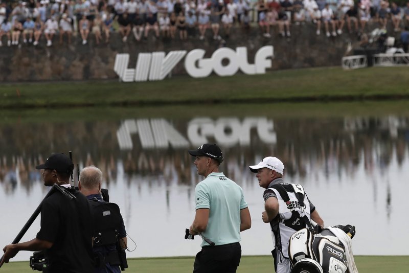 Henrik Stenson (C) and other LIV Golf players could have a "pathway" back to the PGA Tour, according to the terms of the proposed union between the golf leagues. File Photo by Peter Foley/UPI