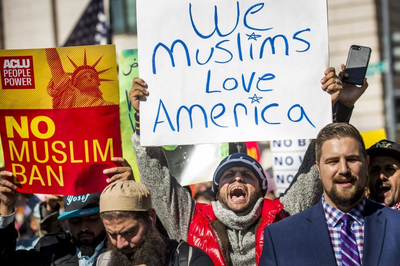 Activists attend a "#NoMuslimBanEver" rally in Lafayette Park in front of the White House on Wednesday. Sponsored by the Council on American-Islamic Relations, the march protested what the group says are discriminatory policies that target American Muslim and immigrant populations in the United States. Photo by Pete Marovich/UPI