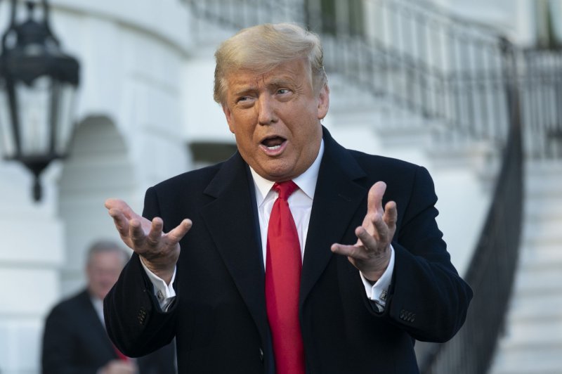 President Donald Trump speaks to reporters at the White House on Wednesday before he leaves for a campaign trip to North Carolina. Photo by Chris Kleponis/UPI/Pool