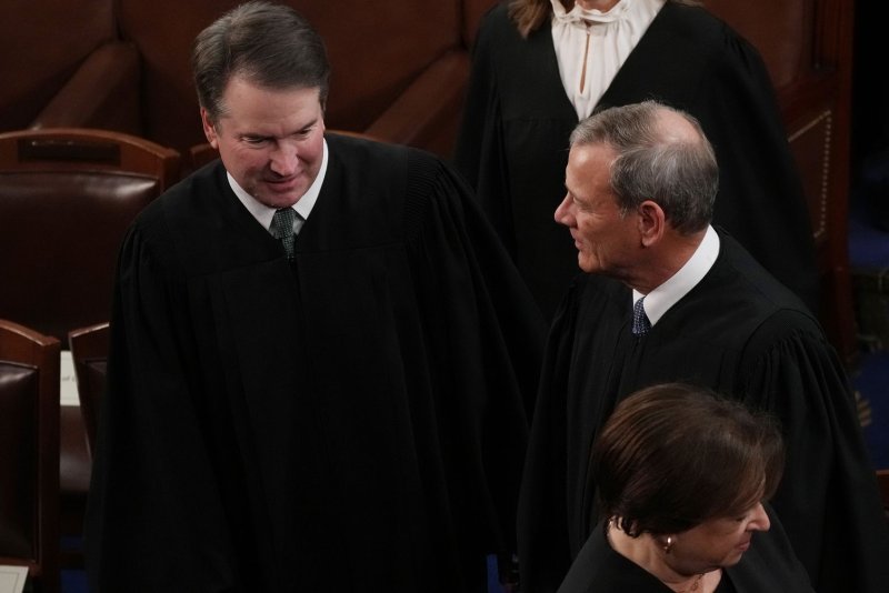 Chief Justice John Roberts (R) and Associate Justice Brett Kavanaugh (L) joined the court's three liberal justices, including Associate Justice Elena Kagan (bottom) in saying the Alabama electoral map went too far and illegally diluted Black voting power and must be redrawn. File Photo by Pat Benic/UPI