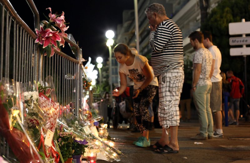 Flowers, candles and teddy bears line the Promenade des Anglais as people mourn in Nice, France, on July 16, 2016, after a terror attack killed 86 people. File Photo by Maya Vidon-White/UPI