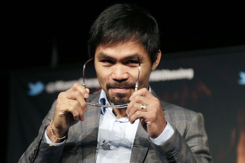 Manny Pacquiao sits on stage at a news conference to promote an upcoming boxing match against Timothy Bradley on January 21, 2016 at Madison Square Garden in New York City. Manny Pacquiao is preparing to fight for the last time as a professional boxer, when he takes on American Timothy Bradley for the third time in his career on April 9 at the MGM Grand in Las Vegas Nevada. Photo by John Angelillo/UPI