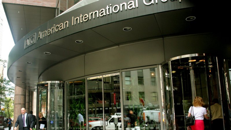 Employees enter and exite the American International Group building in the financial district after the government bailed out the insurance company on September 17, 2008 in New York City. The U.S.'s two-year, $85 billion loan was in exchange for an 80 percent stake in the insurance company. (UPI Photo/Monika Graff)