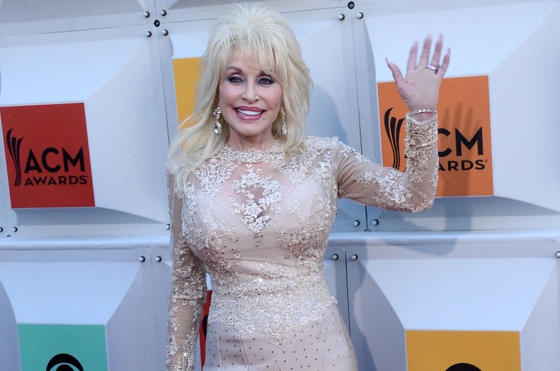 Dolly Parton will be featured in the Guinness World Records 2018 edition for Most decades with a Top 20 hit on the US Hot Country Songs chart. File Photo by Jim Ruymen/UPI | <a href="/News_Photos/lp/d7ea513f446ea96159ca4096b0cf8c4d/" target="_blank">License Photo</a>