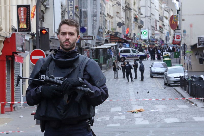 France arrested 23 people after conducting more than 150 police raids early Monday as officials identified the suspected mastermind behind the deadly Islamic State attacks in Paris. French Prime Minister Manuel Valls said the attacks were coordinated from Syria as the police raids were carried out against a "terrorist army." Photo by David Silpa/UPI