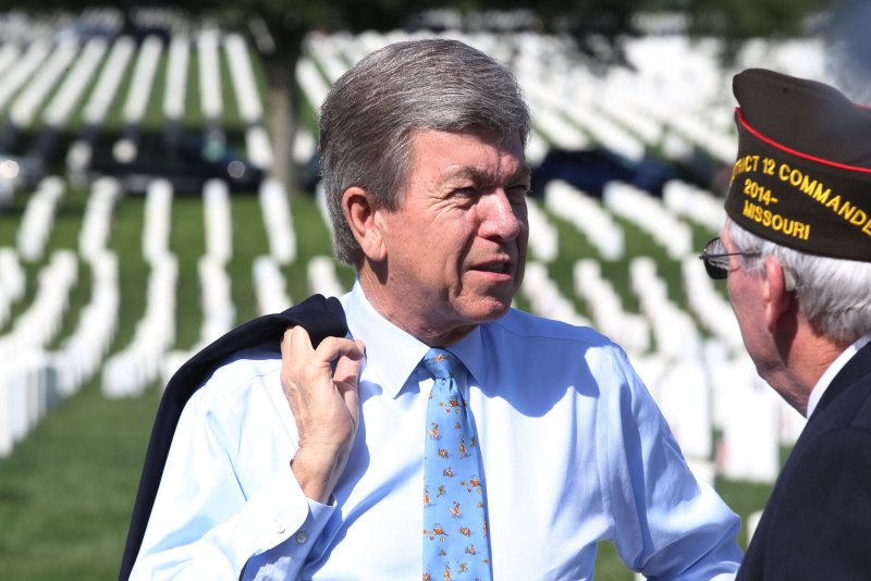 U.S. Senator Roy Blunt R-Mo, talks with a veteran before Memorial Day ceremony at Jefferson Barracks National Cemetery in St. Louis on May 30. Photo by Bill Greenblatt/UPI
