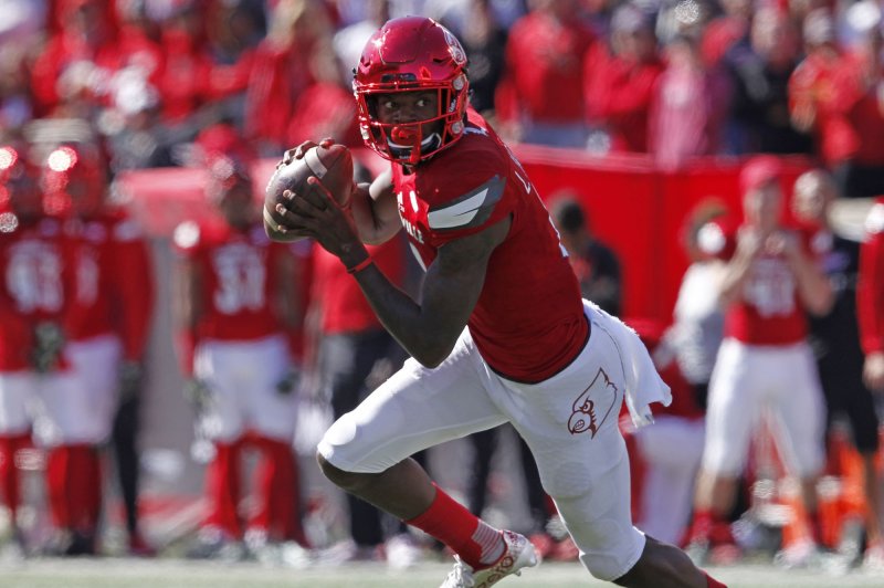 Former Louisville Cardinals quarterback Lamar Jackson (8) throws under pressure from NC State's defense during the second half of play on October 22, 2016 at Papa John's Cardinal Stadium in Louisville, Kentucky. File photo by John Sommers II/UPI