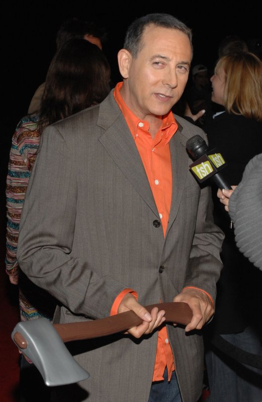 Actor Paul Reubens, a cast member in the political satire horror motion picture "The Tripper", carries a prop ax as he arrives for the film's premiere at Hollywood Forever Cemetery in Los Angeles on April 11, 2007. Patricia Arquette stars in the NBC television drama series "Medium". (UPI File Photo/Jim Ruymen)