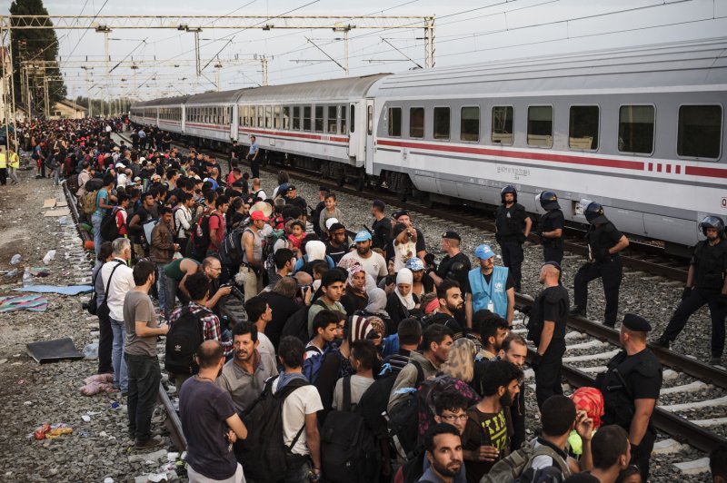 A 13-year-old German girl from Berlin's Russian community admits she lied about being abducted and gang raped by three Middle Eastern men several weeks ago. Pictured, migrants and refugees wait for a train that will transport them to Austria, in Tovarnik, Croatia, on September 19. File Photo by Achilles Zavalli/UPI