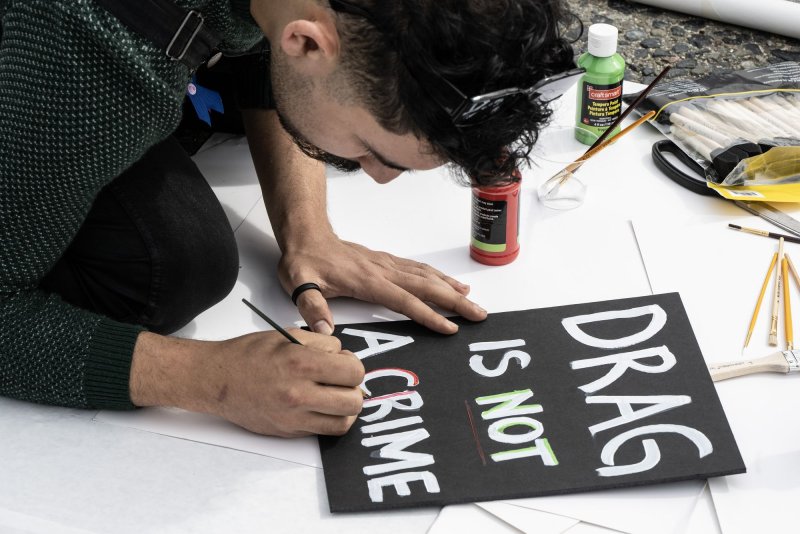 Participants make signs for a rally and march to support the drag and transgender communities at City Hall in San Francisco, on April 8. A federal judge on Friday temporarily blocked a Montana law that prohibits some drag performances. File Photo by Terry Schmitt/UPI