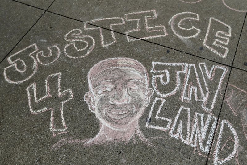 Sidewalk art in the street in front of the Akron City Justice Center in Akron, Ohio, on July 2 calls for justice for Jayland Walker. His funeral was Wednesday. Photo by Aaron Josefczyk/UPI | <a href="/News_Photos/lp/45c675714d78893f884178b6c60c5b87/" target="_blank">License Photo</a>