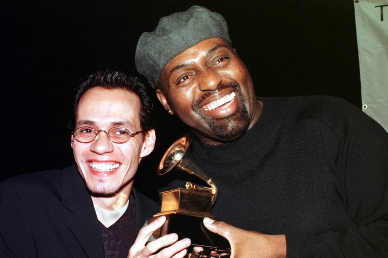 NYP99010501 - 05 JANUARY 1999 - NEW YORK , NEW YORK , USA: Marc Anthony (left) and Frankie Knuckles ham it up with a Grammy award prop, Janauary 5th, after they where nominated for their work in the catagories of "Best Tropical Latin Performance" and "Remixer of the Year, Non Classical" at the 41st Annual Grammy nominee press conference held in New York City . wy/ep/Ezio Petersen UPI | <a href="/News_Photos/lp/ff2e63cd378c75fc53b43f35cd1fcbb4/" target="_blank">License Photo</a>