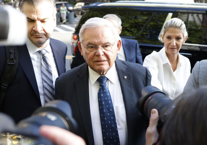 Democratic New Jersey Sen. Robert Menendez walks into Manhattan Federal Court on Wednesday where he faces charges in a plot to accept hundreds of thousands of dollars in bribes including cash, gold bars, a Mercedes convertible and mortgage payments. Photo by John Angelillo/UPI