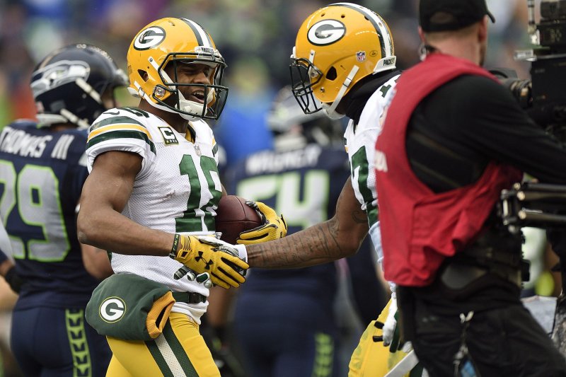 Randall Cobb, left, of the Green Bay Packers celebrates a touchdown pass with teammate Davante Adams (17) in the NFC Championship game at CenturyLink Field in Seattle, Washington on January 18, 2015. Seattle won 28-22. Photo by Troy Wayrynen/UPI