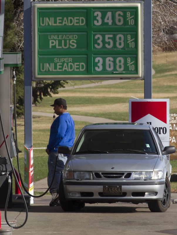 With his keys dangling, a driver watches the pump as his car is filled at a lower priced gas station in Denver on April 15, 2011. Consumers paid an average price of $3.52 a gallon nationwide Wednesday according to the travel group AAA. UPI/Gary C. Caskey | <a href="/News_Photos/lp/16d0241fdd82d5f0500f829ca9575c2d/" target="_blank">License Photo</a>
