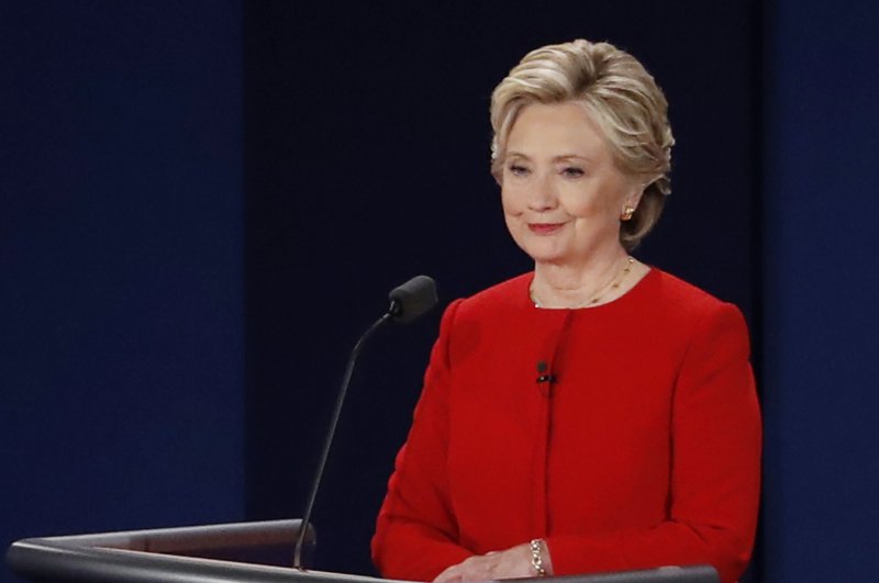 Democrat Hillary Clinton listens to Republican Donald Trump during the first presidential debate at Hofstra University in Hempstead, N.Y., on Monday. Flash polls conducted after the debate showed Clinton was deemed the winner by a majority of those watching. Photo by John Angelillo/UPI