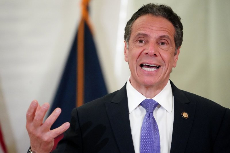 N.Y. woman says Gov. Cuomo inappropriately kissed her during home visit