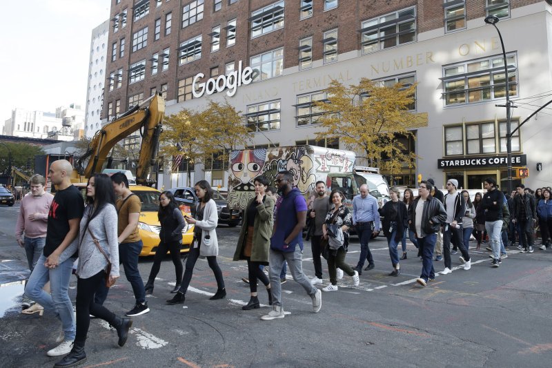 People exit the Google office on 8th Avenue and walk to 14th Street Park for a rally on November 1, 2018 in New York City, protesting the company for its handling of sexual harassment and what they say is a failure to police gender- and race-based discrimination. File Photo by John Angelillo/UPI