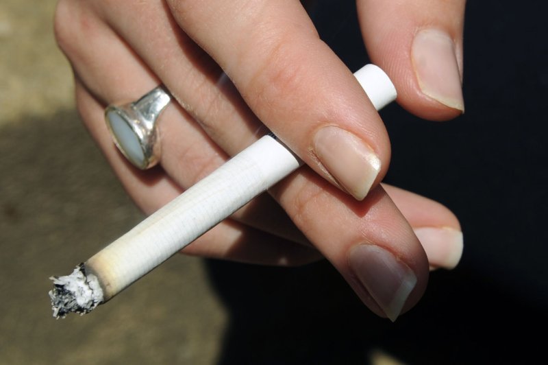 A woman smokes a cigarette in Arlington, Virginia. (UPI Photo/Alexis C. Glenn)