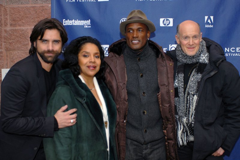 Left to right, John Stamos, Phylicia Rashad, Kenny Leon and Neil Meron attend the premiere of their film "A Raisin in the Sun" in Park City, Utah in 2008. Meron is producing a film version of the musical "13" for Netflix. File Photo by Alexis C. Glenn/UPI