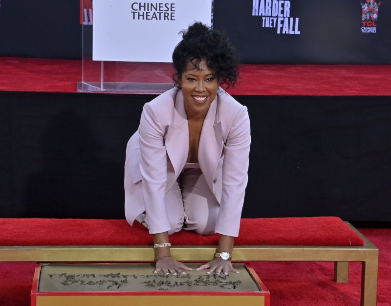Regina King participates in a handprint and footprint ceremony immortalizing her in the forecourt of the TCL Chinese Theatre in the Hollywood section of Los Angeles on Thursday. Photo by Jim Ruymen/UPI