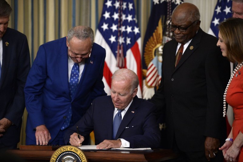 President Joe Biden signs the Inflation Reduction Act, which has provisions aimed at slowing climate change. Photo by Bonnie Cash/UPI | <a href="/News_Photos/lp/891c79ed3d826519719da29bcb88dec7/" target="_blank">License Photo</a>