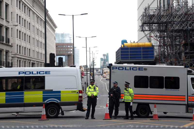 Police officers cordon off London Bridge on Sunday. The previous night, three men killed seven people and injured 48 after driving a van at pedestrians along the bridge and a subsequent knife attack in nearby Borough Market. Photo by Hugo Philpott/UPI