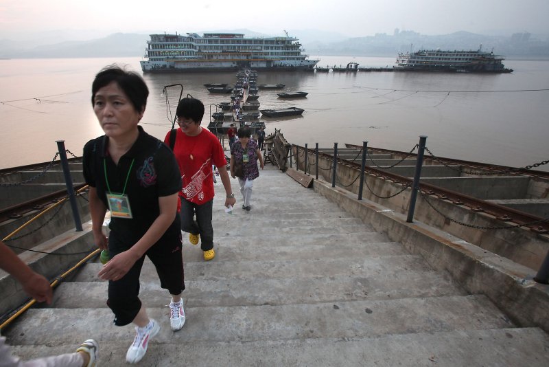Chinese tourists leave their cruise ships in Chongqing, China. The city is the site of the world’s largest former nuclear base, which was reopened after a yearlong renovation, according to China News Service. File Photo by Stephen Shaver/UPI