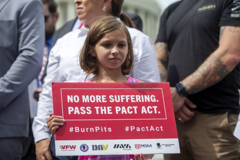 Brielle Robinson, the 9-year-old daughter of Sgt. First Class Heath Robinson, holds a poster during a press conference on the Senate's failure to pass The PACT Act at the U.S. Capitol in Washington, D.C., on Thursday. Photo by Bonnie Cash/UPI