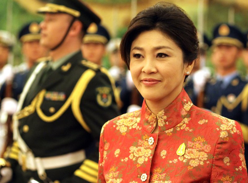Thai Prime Minister Yingluck Shinawatra walks past a military honor guard during a welcoming ceremony in the Great Hall of the People in Beijing April 17, 2012. UPI/Stephen Shaver
