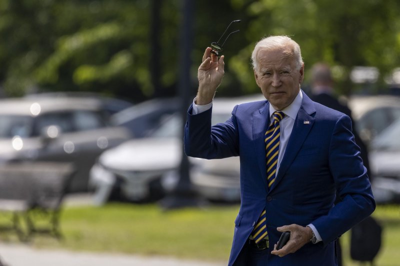 President Joe Biden waves to the press as he walks to board Marine One at the White House on Friday. The Biden administration on Monday announced plans for 55 million donated coronavirus vaccines to poorer countries. Photo by Tasos Katopodis/UPI