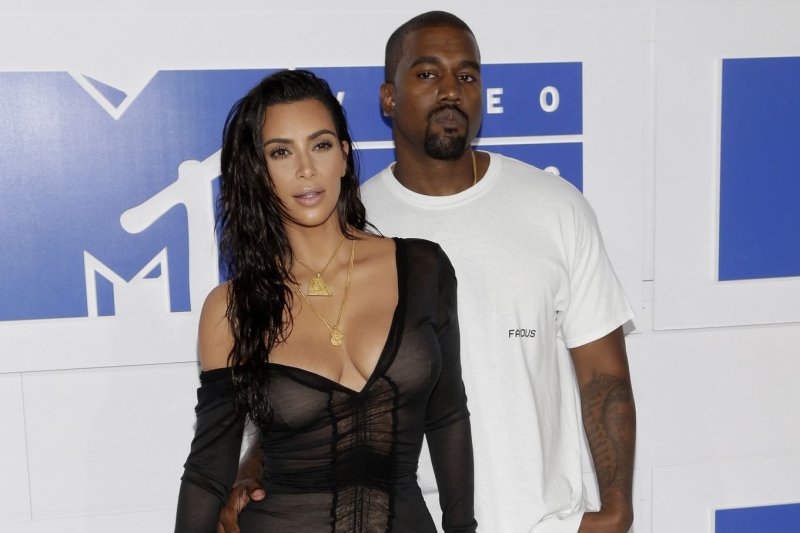 Kanye West (R) with his wife Kim Kardashian. West posted on Twitter about a moment he shared with Lamar Odom. File Photo by John Angelillo/UPI | <a href="/News_Photos/lp/f58e99a092bd2e77f5a43f6b33594fea/" target="_blank">License Photo</a>